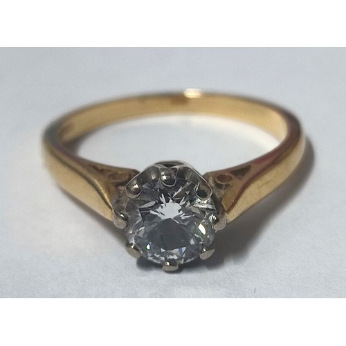 24 - A traditional 18ct. Gold and Diamond solitaire ring, claw set, Gold shank with round brilliant cut D... 