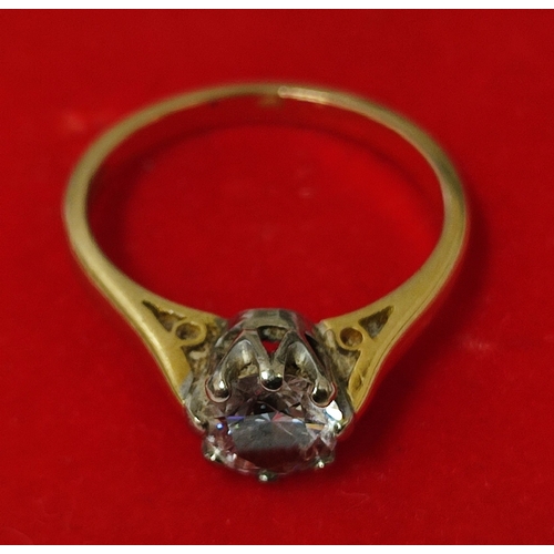 24 - A traditional 18ct. Gold and Diamond solitaire ring, claw set, Gold shank with round brilliant cut D... 