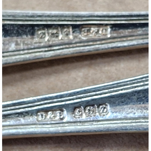 17 - Cased set of 12 hallmarked 1924 Birmingham silver tea spoons together with a sugar nip,

155 grams