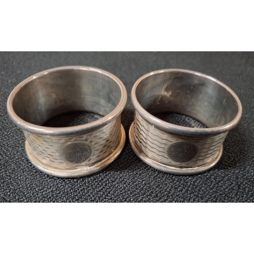 23 - Pair of Birmingham hallmarked silver napkin rings with engine turned decoration together with 2 othe... 