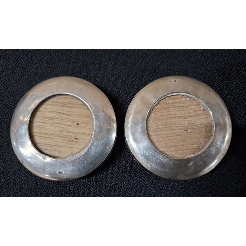 26 - Four small Edwardian free-standing oval and circular silver photo frames (4)