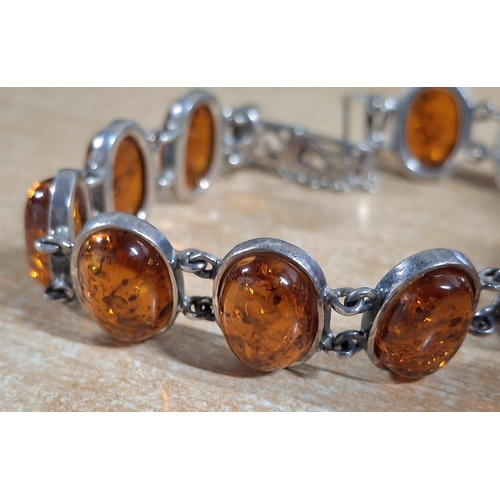 31 - Ladies 925 stamped silver bracelet with 11 Amber cabochons