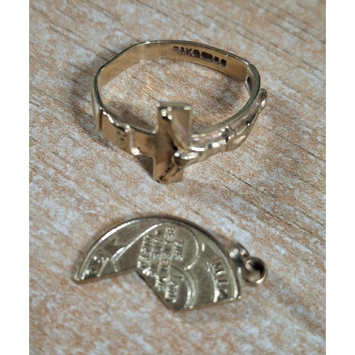 38 - Two 9ct yellow hallmarked gold items, to include a small ring featuring an image of Christ on the cr... 