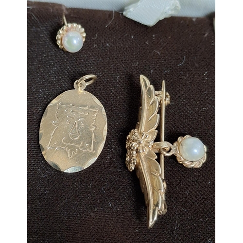 41 - Hallmarked 9ct yellow gold brooch with floral and grape bunch decoration above a drop pearl together... 