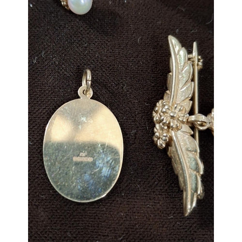 41 - Hallmarked 9ct yellow gold brooch with floral and grape bunch decoration above a drop pearl together... 