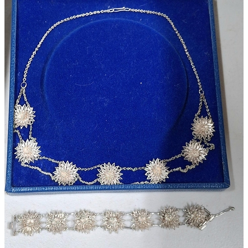43 - Stunning quality, ladies unmarked silver coloured ornate metal necklace with matching bracelet in pr... 