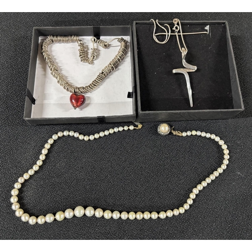 54 - Silver necklace and pendant with a Silver pearl necklace and a necklace with a red love heart the cl... 