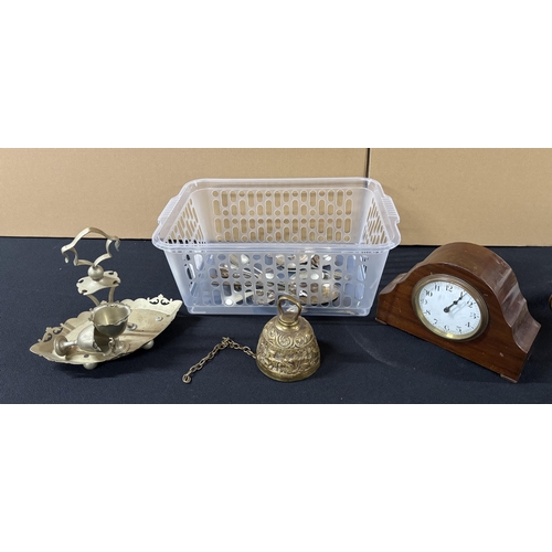 316 - Collection of metal-ware including spoons and bell etc with mantle clock,

Please note - Plastic tub... 