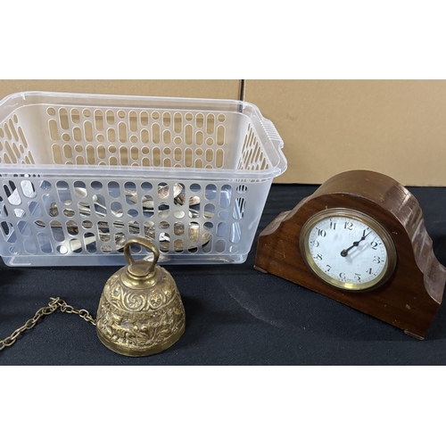 316 - Collection of metal-ware including spoons and bell etc with mantle clock,

Please note - Plastic tub... 