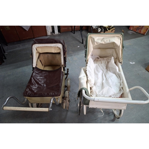 569 - Two mid 20thC, large metal doll prams (2)