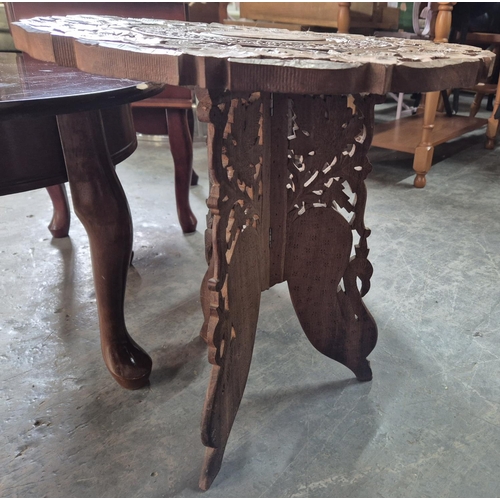 659 - Four small, wooden side-tables to include 2 carved foldaway Indian examples (4)