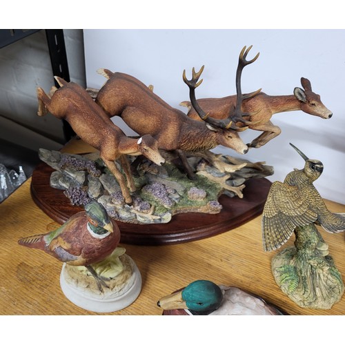 393 - Collection of ceramic animals on plinths (Qty)