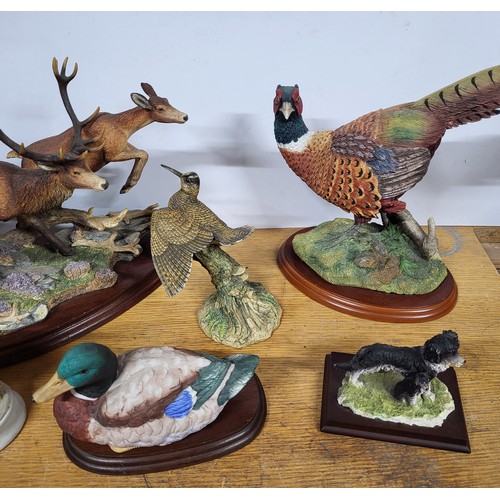 393 - Collection of ceramic animals on plinths (Qty)