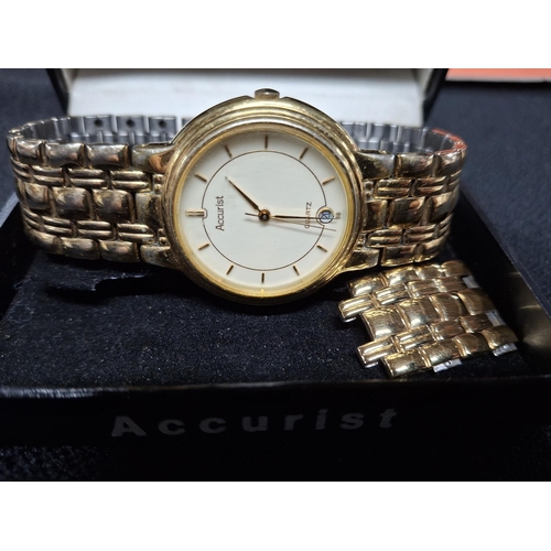 152 - Gents quartz analogue wrist watch with gilt metal strap, boxed with original booklet