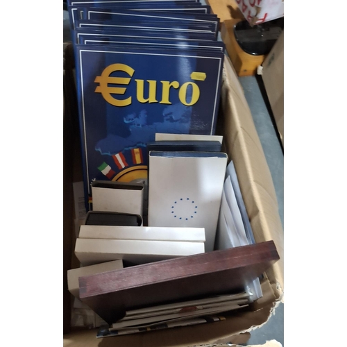 212 - Box full of unused coin album boxes including a quantity of Euros sets (Qty)