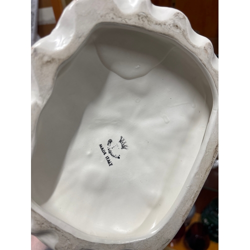 387 - Capodimonte figure of a man sat on a bench