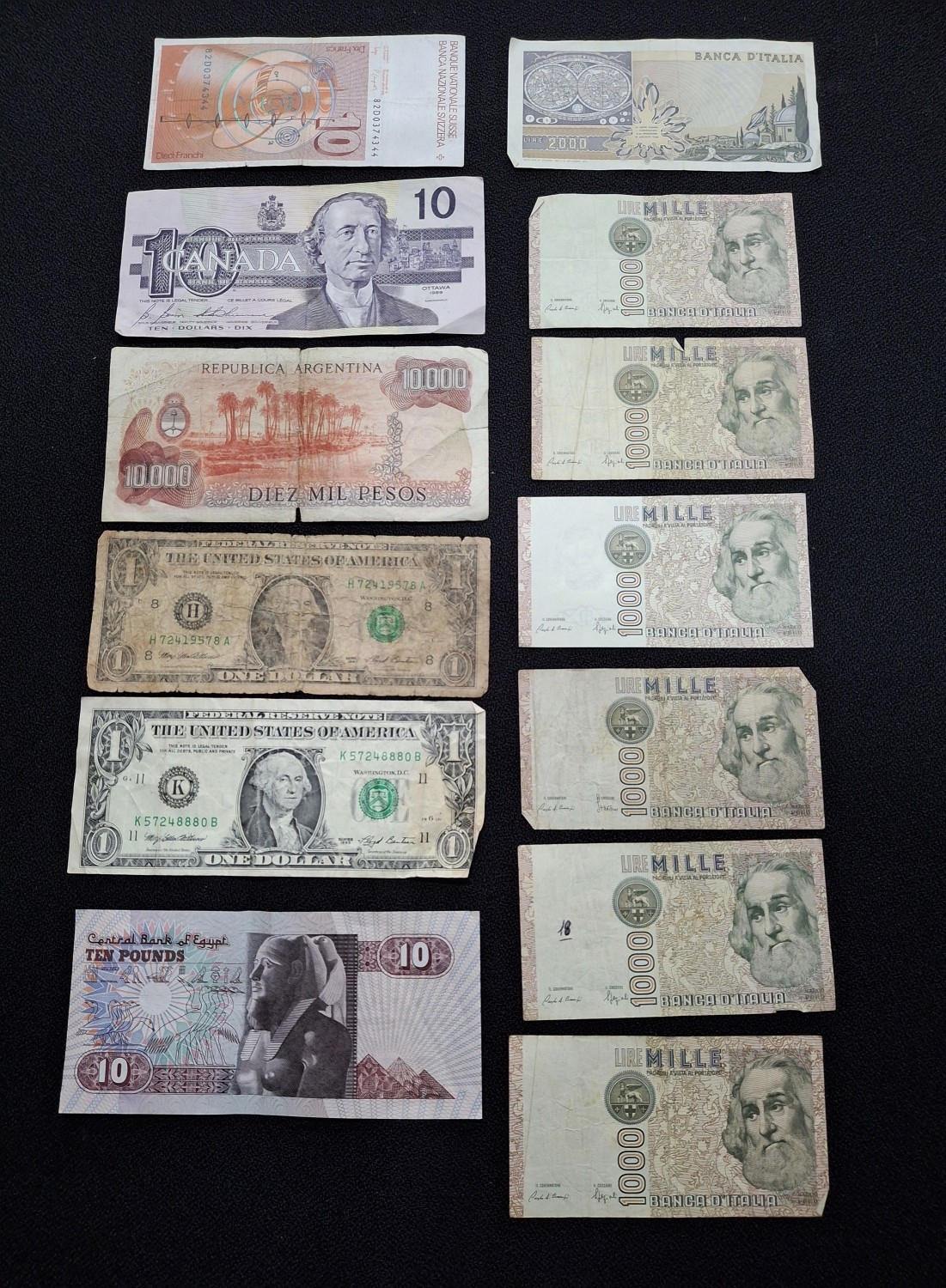 Thirteen bank notes to include a 10 Swiss franc note, 2 x US$1, $10 ...