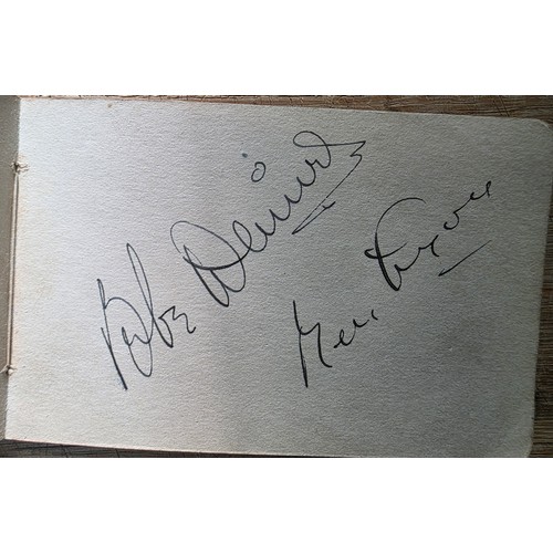 Three autograph books containing mid 20thC autographs, largely ...