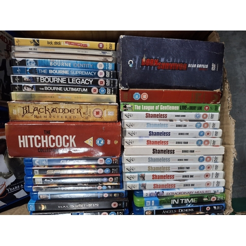 Box of DVDs, Shameless set, Bourne Legacy set, Hitchcock set ...