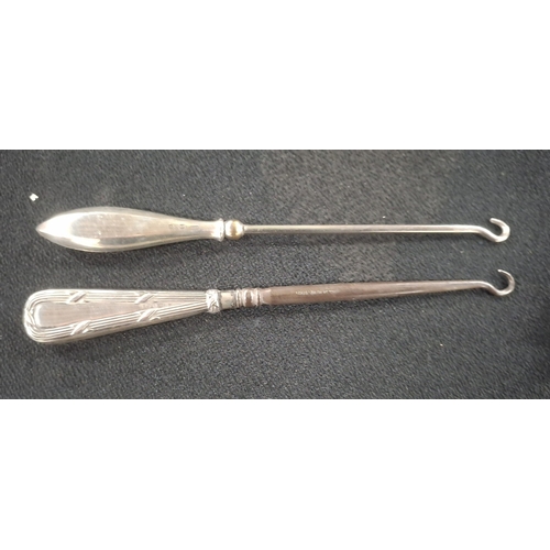 16 - Chester hallmarked silver handled button hook together with a Birmingham hallmarked silver handled b... 