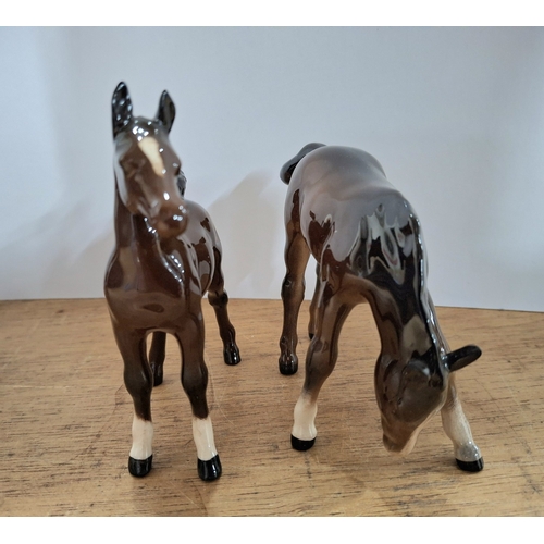 39 - Two Beswick matt foals together with two Beswick bisque foals (4)