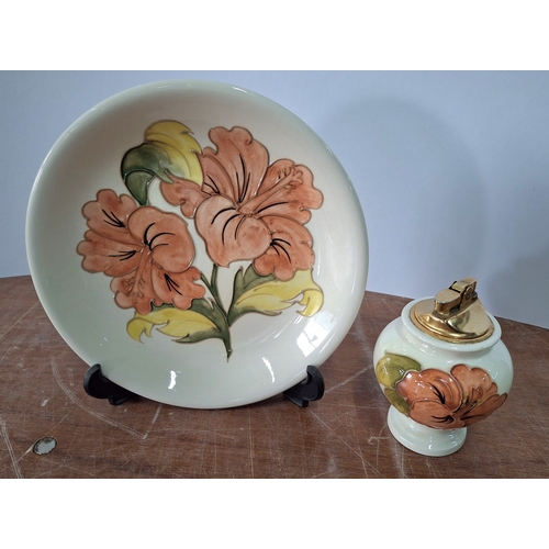 25 - Moorcroft Hibiscus pattern plate, signed in initial to under-side, with associate Moorcroft table li... 