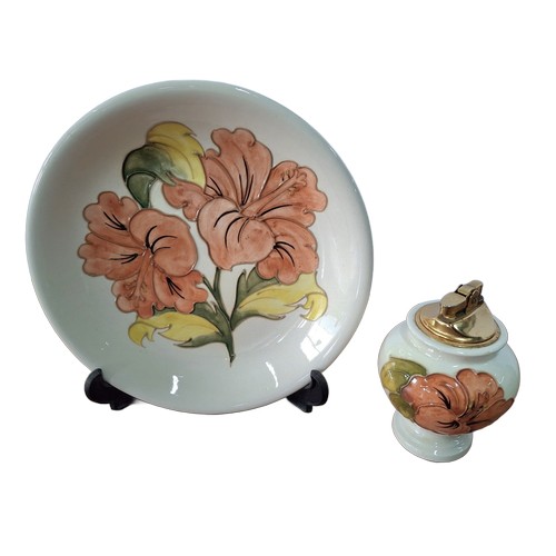 25 - Moorcroft Hibiscus pattern plate, signed in initial to under-side, with associate Moorcroft table li... 