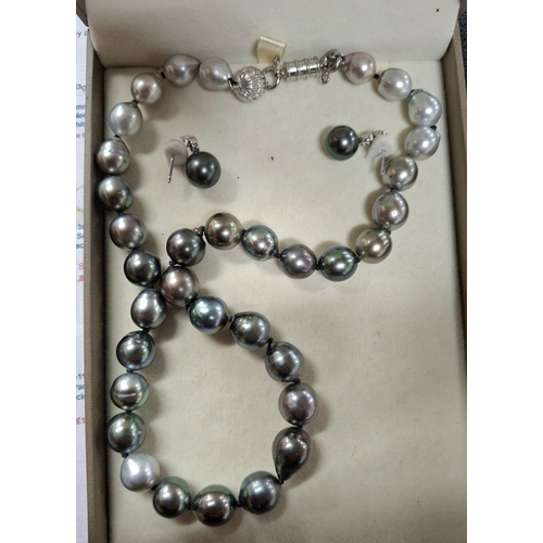 29 - Boxed set of 9-12mm Tahitian graduating Pearl necklace with matching earrings with large, hallmarked... 