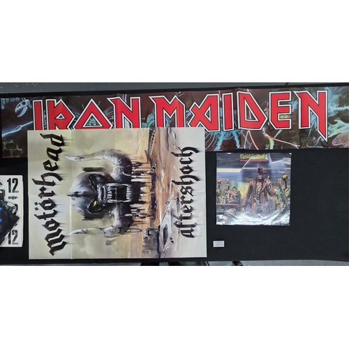 104 - Large elongated Iron Maiden poster & empty 12