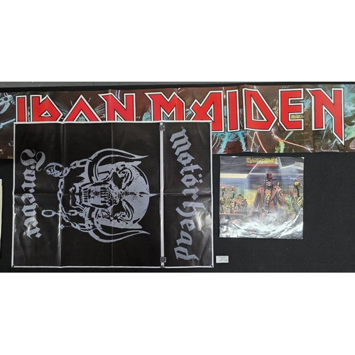 104 - Large elongated Iron Maiden poster & empty 12