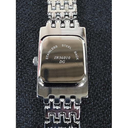 11 - Ladies' Ingersoll wristwatch in original case with spare link etc.