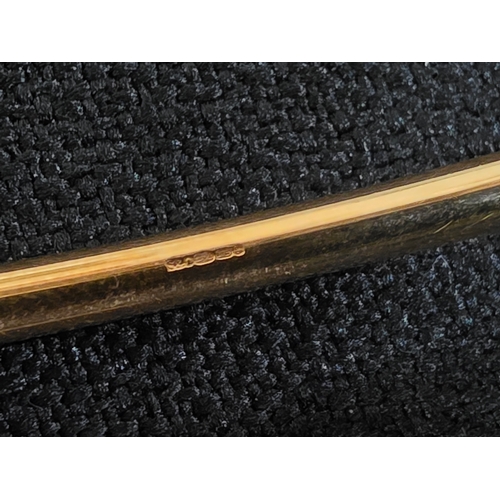 22 - Hallmarked 9ct. Gold solid torque bangle, 22.1 grams