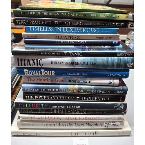 231 - Large quantity of various large coffee table books including John Lennon, Terry Pratchett, L Ron Hub... 