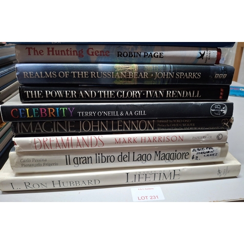 231 - Large quantity of various large coffee table books including John Lennon, Terry Pratchett, L Ron Hub... 
