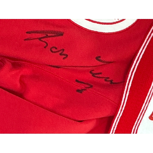 Two Liverpool football club shirts ( one signed) and a Liverpool fc Scarf