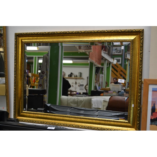 615 - Gilt framed bevelled mirror (W64cm x 90cm)