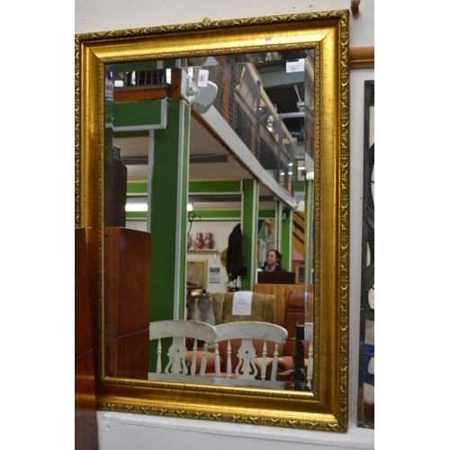 615 - Gilt framed bevelled mirror (W64cm x 90cm)