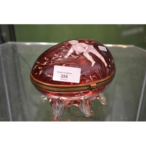 224 - Collection of glass over two shelves including Mary Gregory cranberry glass egg shaped casket (sligh... 