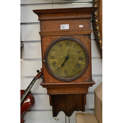 560 - Oak wall hanging clock, R Foxton of Derby, no weights