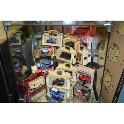 292 - Collectable cars in boxes on bottom shelf