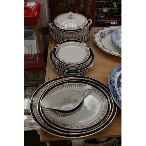 400 - Burslem part dinner service in navy and gilt