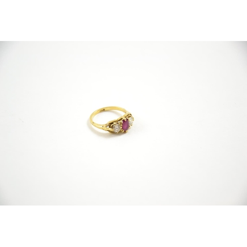 655 - 18ct gold, ruby & diamond three stone ring, size M