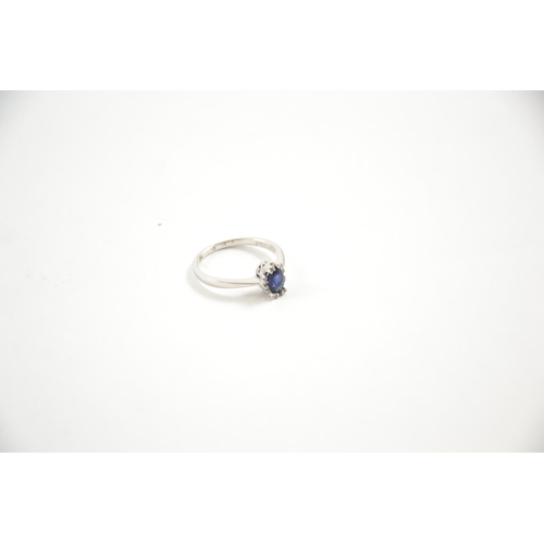 666 - 18ct white gold ring, Sapphire with diamond surround, size N/O