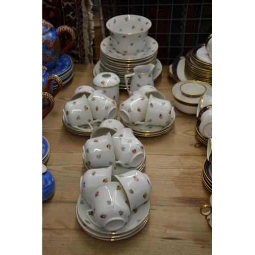 338 - Blue glass vessels over two shelves