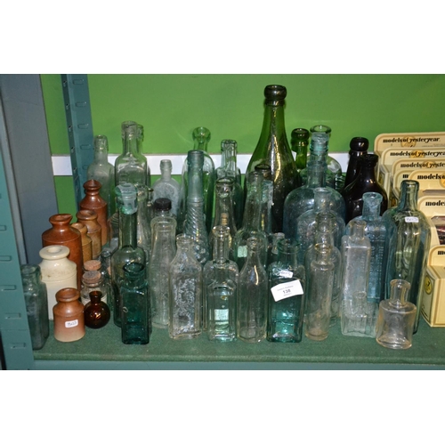 138 - All vintage/antique bottles on shelf.