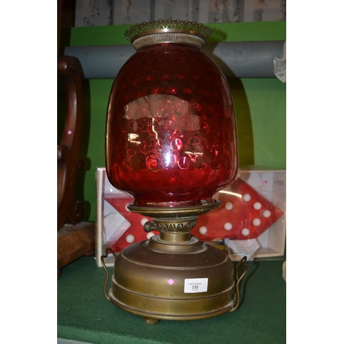 232 - Large German Veritas oil lamp in brass & red glass. H48cm.