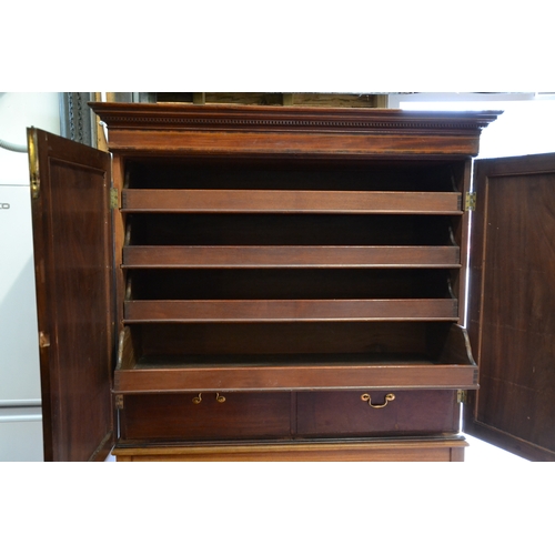 636 - Mahogany linen press with inlaid marquetry on stand. H172cm W120cm