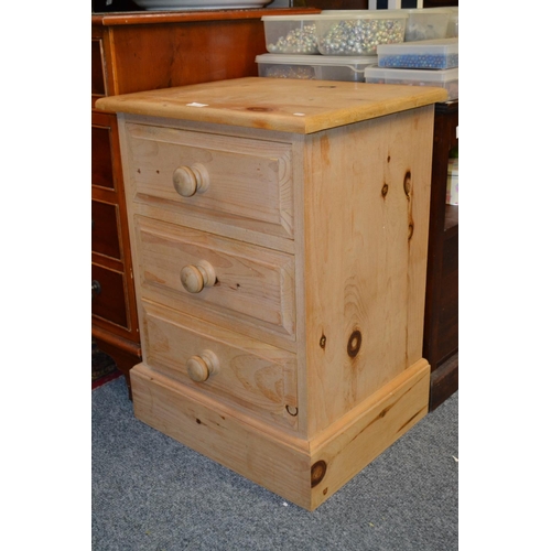 673a - Stripped three drawer pine bedside unit