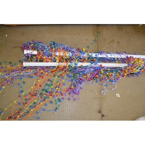 25 - Rainbow coloured beaded curtain