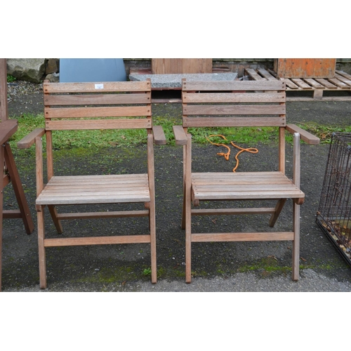 131 - Pair of teak garden chairs